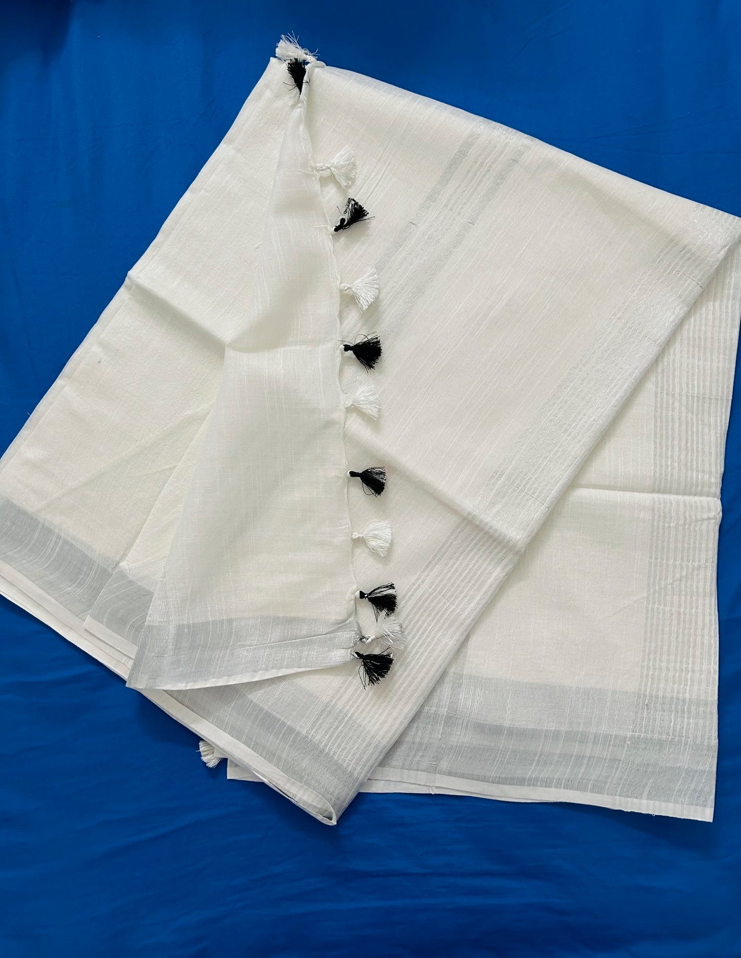 Solid White Linen Saree With Silver Border & Black and white Tassels