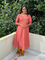Peach embroidered Vichitra silk A-line kurti top(top only)