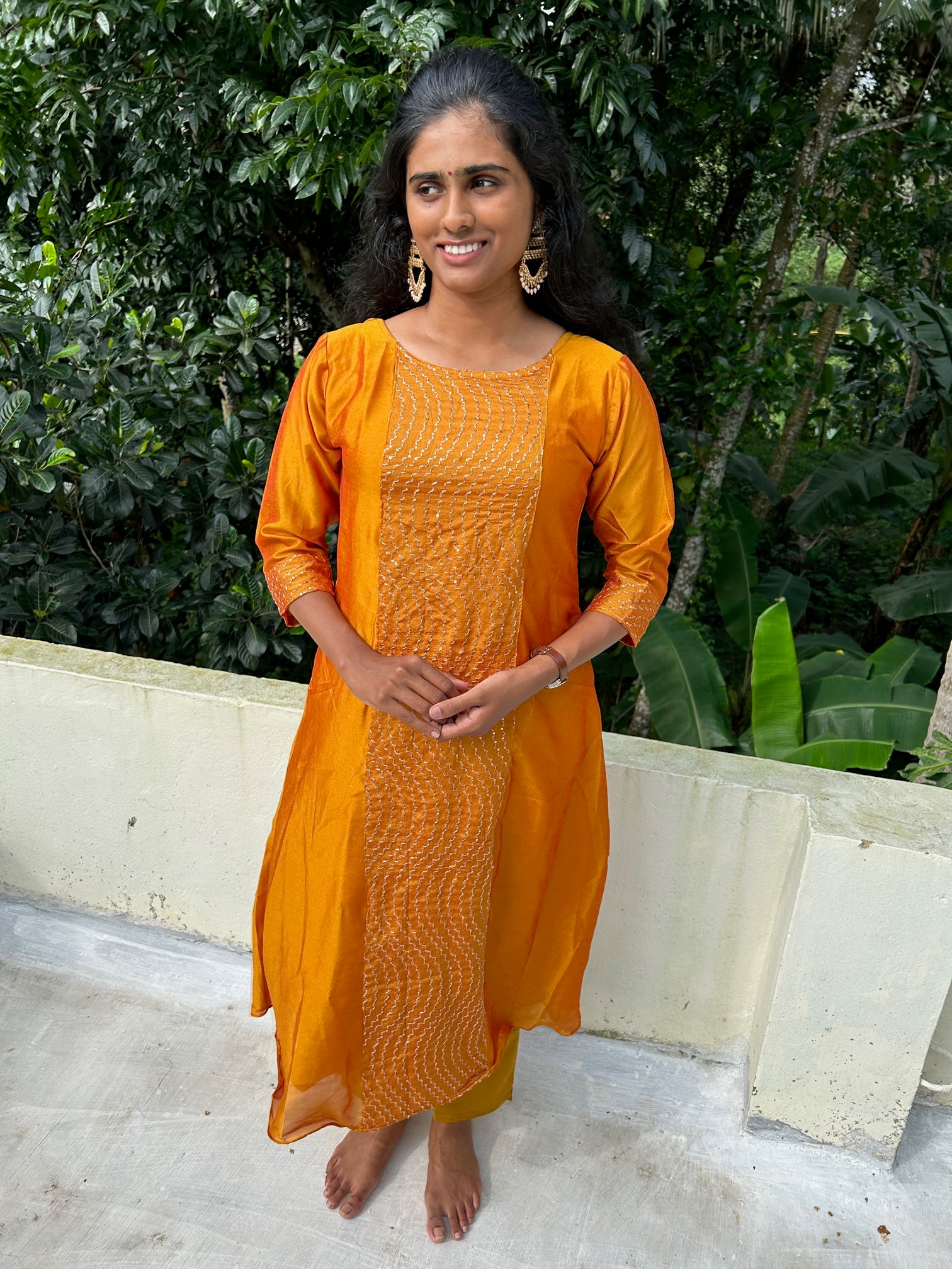 Mango yellow embroidered Vichitra silk A-line kurti top(top only)