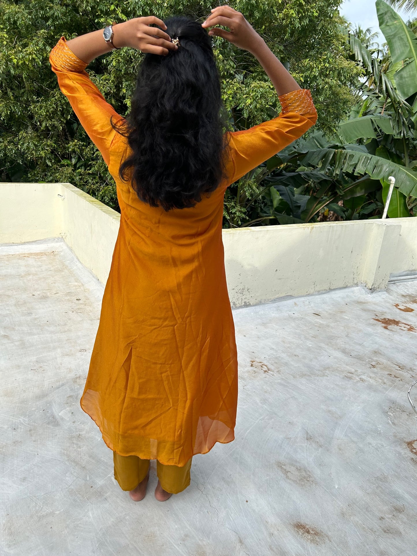 Mango yellow embroidered Vichitra silk A-line kurti top(top only)