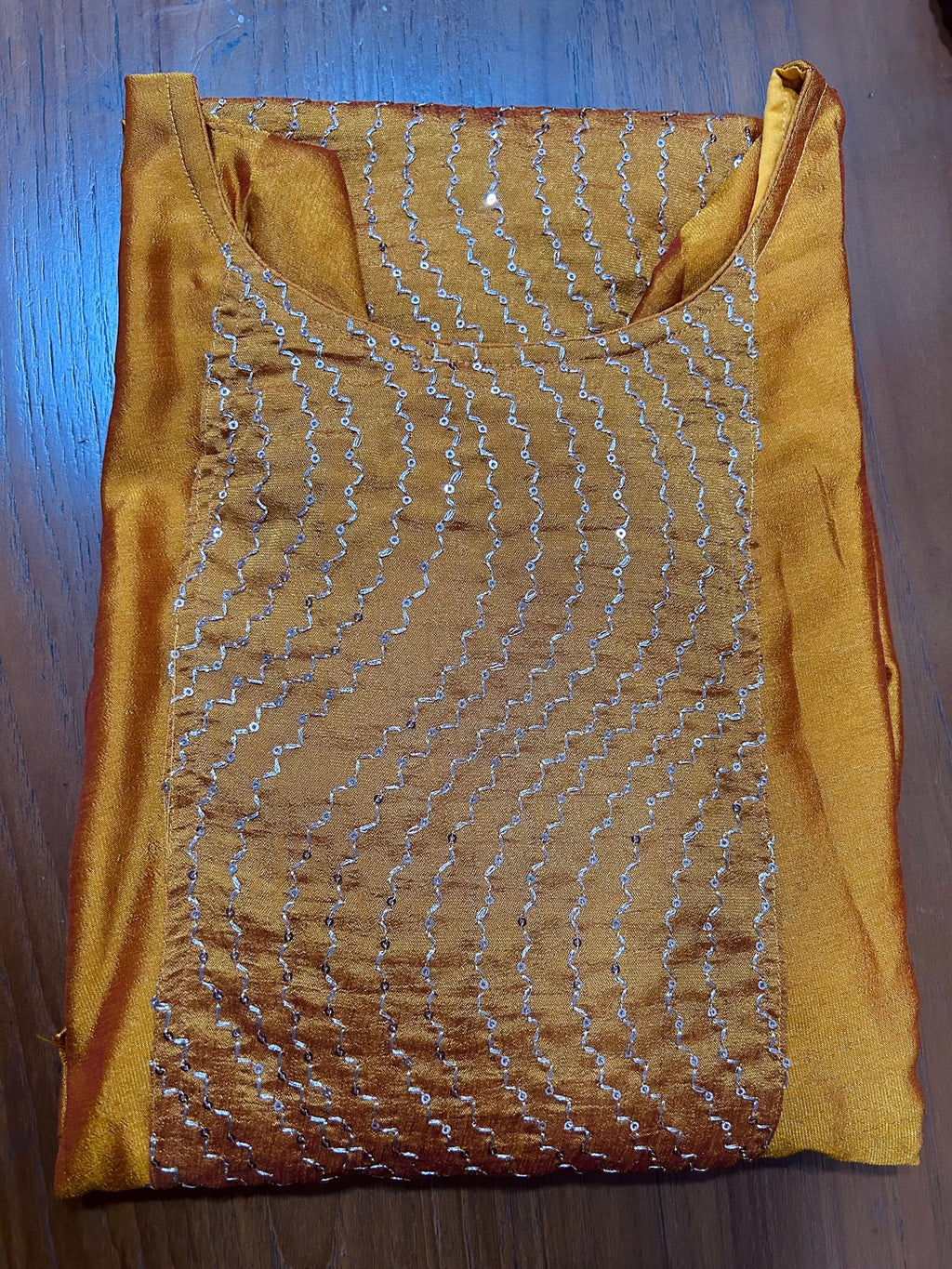 Mango yellow embroidered Vichitra silk A-line kurti top(top only)