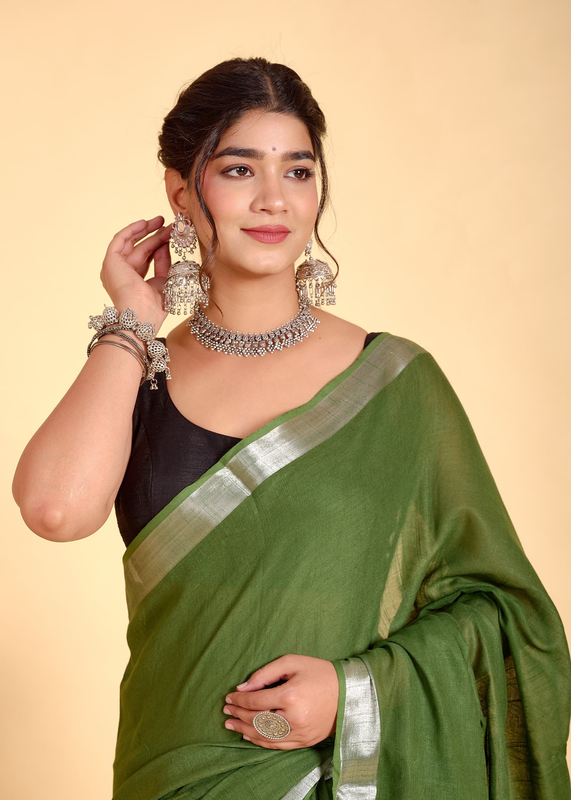 Mehandi Green Linen Saree With Silver Border & Green and white Tassels